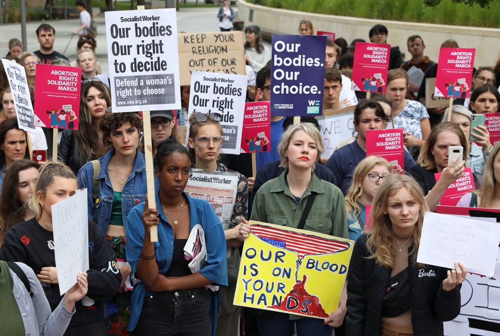 Demonstrators gather outside the United States embassy in Vauxhall, south London to protest against the decision to scrap constitutional right to abortion.