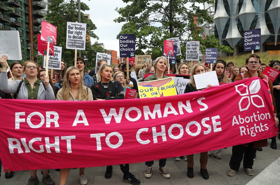 Demonstrators gather outside the United States embassy in Vauxhall, south London to protest against the decision to scrap constitutional right to abortion.