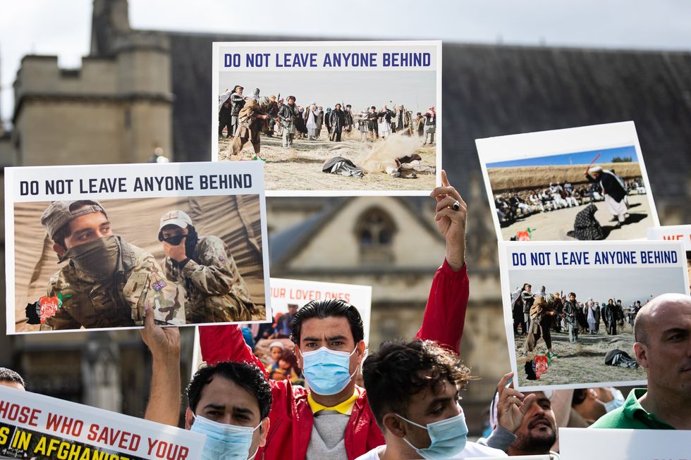 Demonstrators including former interpreters for the British Army in Afghanistan protest in Parliament Square against Taliban and demand human rights in Afghanistan