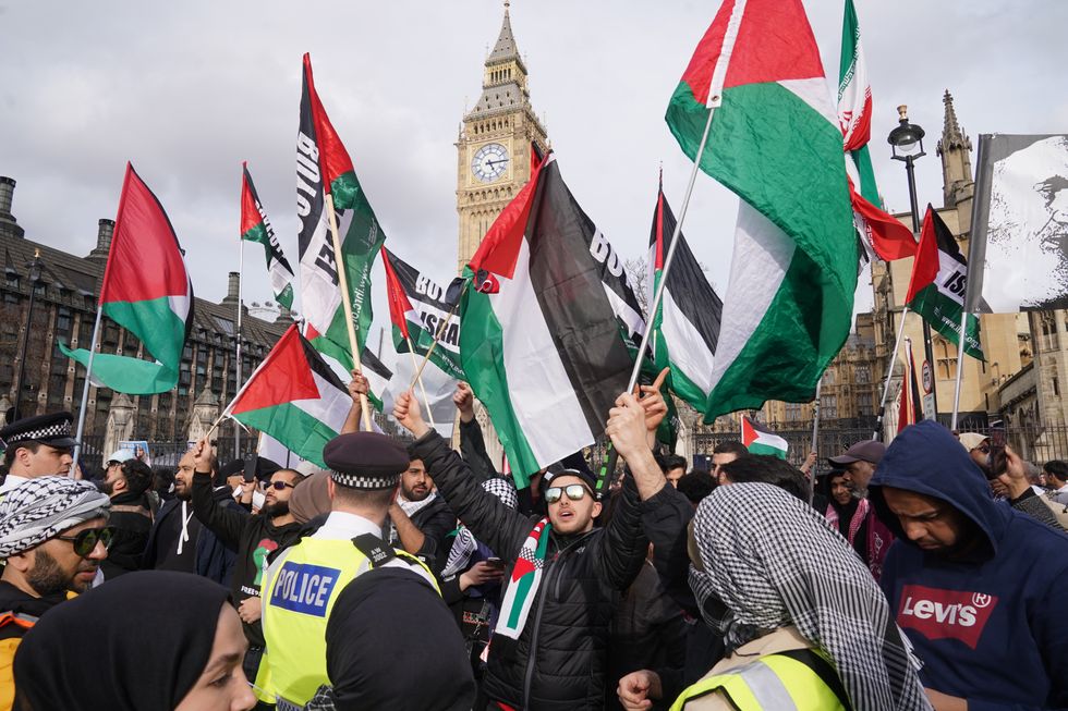 Demonstrators march through London, during an Al-Quds Day rally organised by the Islamic Human Rights Commission in support of Palestinians