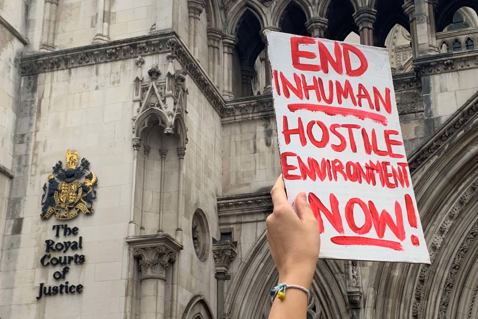 Demonstrators outside the Royal Courts of Justice, central London, protesting against the Government's plan to send some asylum seekers to Rwanda, while a High Court hearing over the policy is ongoing. Picture date: Monday September 5, 2022.