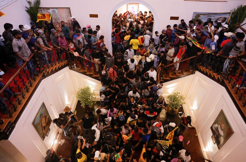 Demonstrators protest inside the President's House premises, after President Gotabaya Rajapaksa fled, amid the country's economic crisis, in Colombo, Sri Lanka.