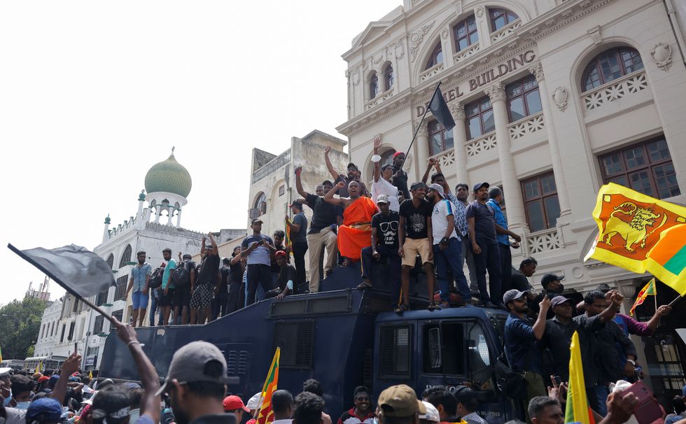 Demonstrators protest outside the President's House, after President Gotabaya Rajapaksa fled, amid the country's economic crisis, in Colombo, Sri Lanka.