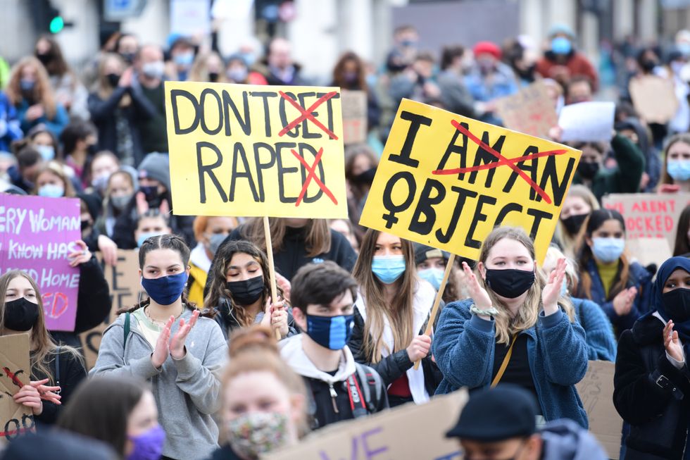 Demonstrators take part in a women's 97% protest march in central London in April 3, 2021.