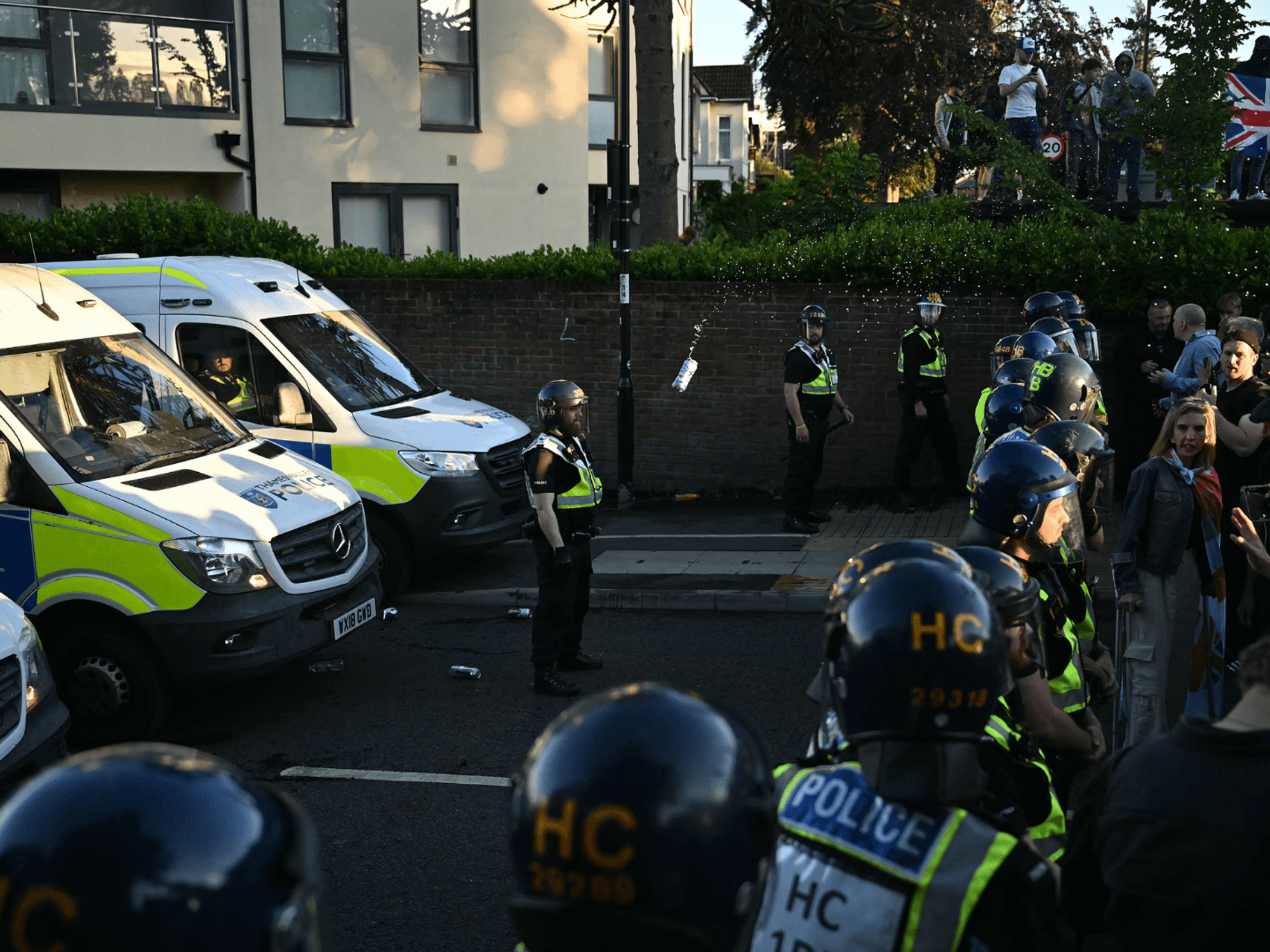 Demonstrators throw items at Police offices