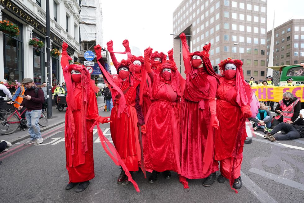 Demonstrators with a bus parked on London Bridge in central London during a protest by members of Extinction Rebellion (XR). XR protesters are set to walk thousands of miles to attend COP26 in Glasgow.