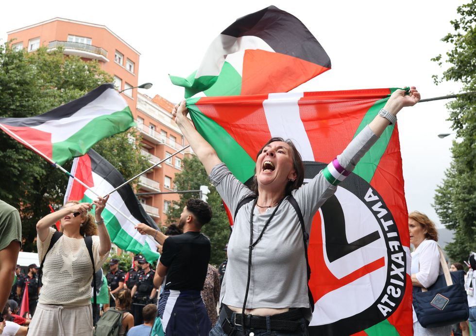 Demonstrators with flags forced the race to call an early halt