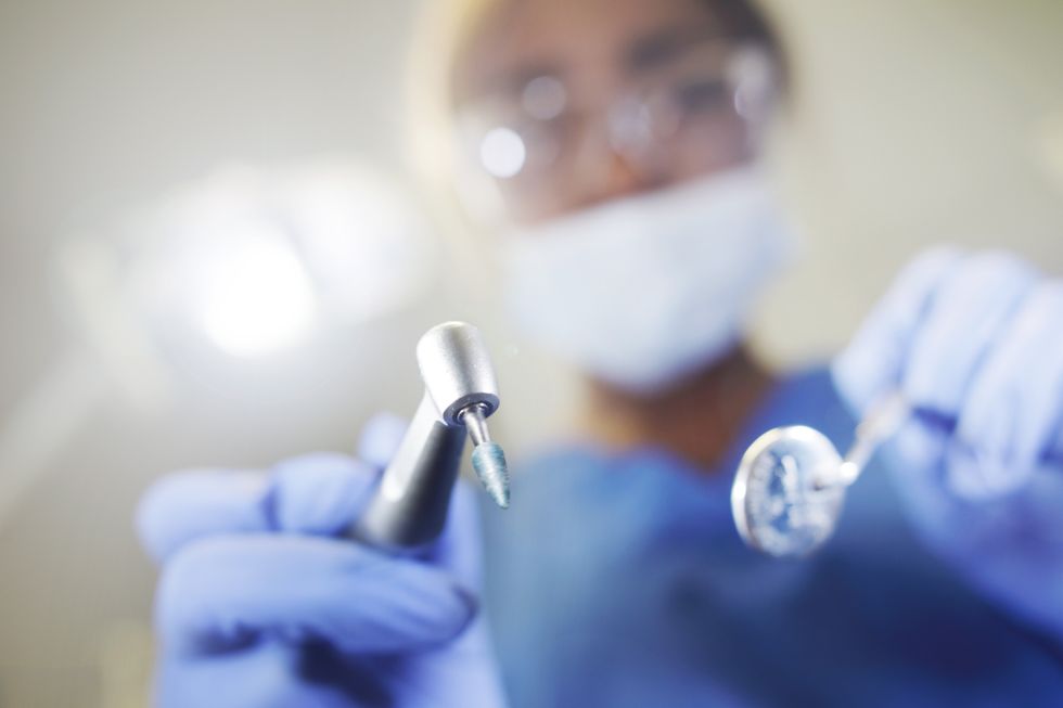 Dentist performing surgery