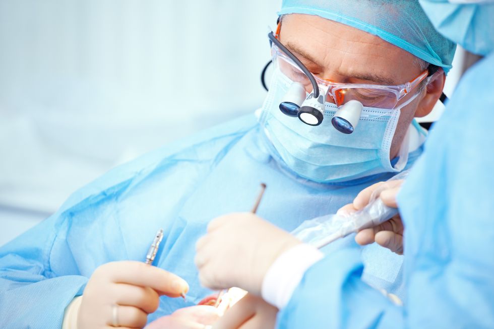 Dentists operating on a patient