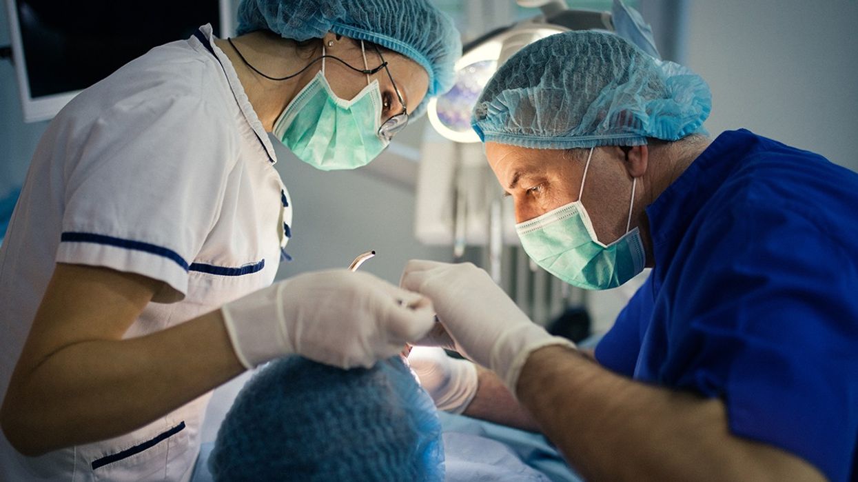 Dentists performing surgery