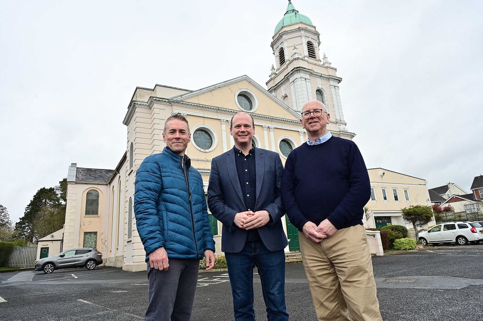 Department for Communities of Communities Minister Gordon Lyons (centre) with Kerry Rooney (left), National Churches Trust and Richard McChesney, outside Whiteabbey Presbyterian Church in Newtownabbey