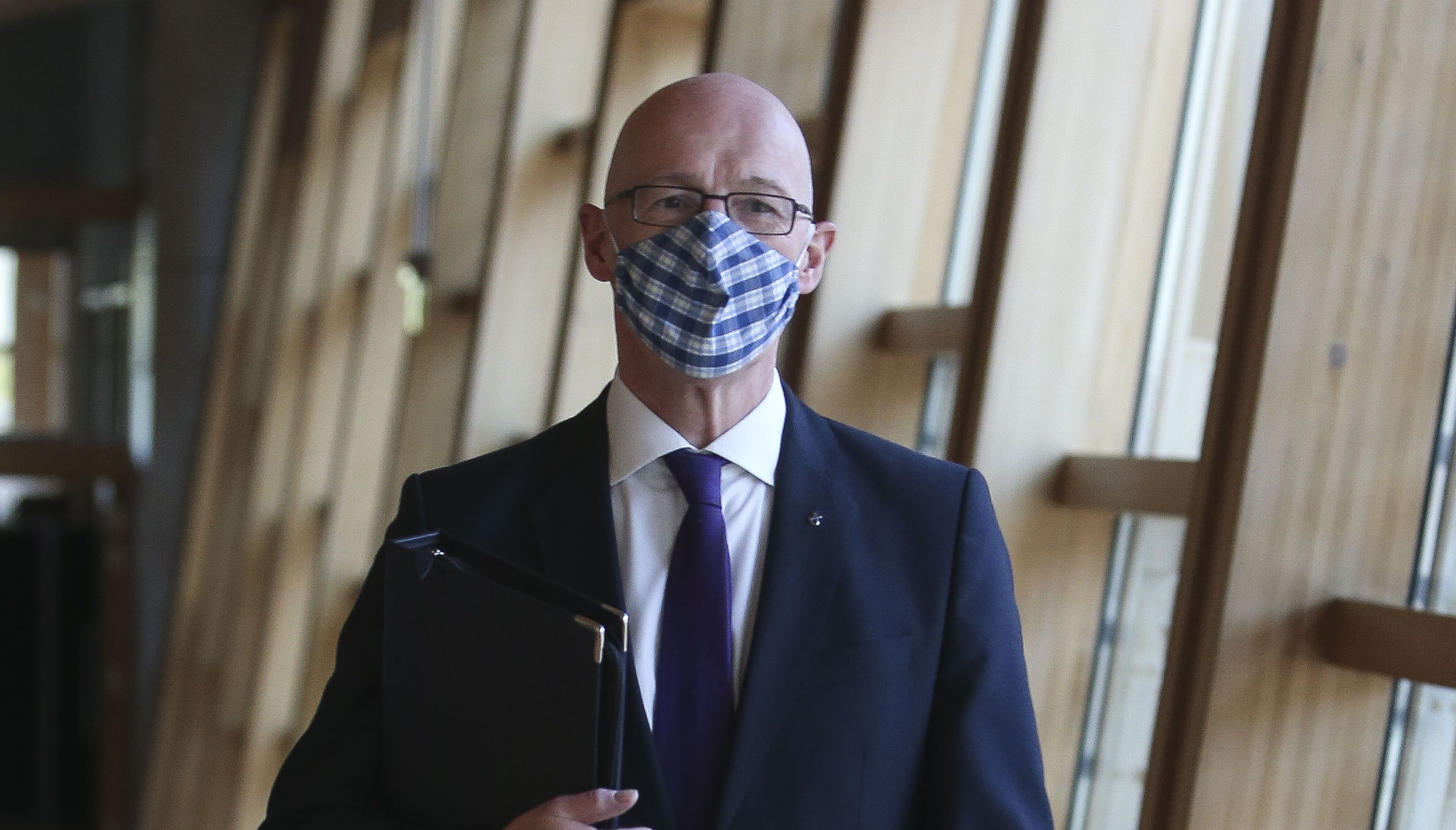 Deputy First Minister John Swinney arrives to make a statement at the Scottish Parliament in Edinburgh
