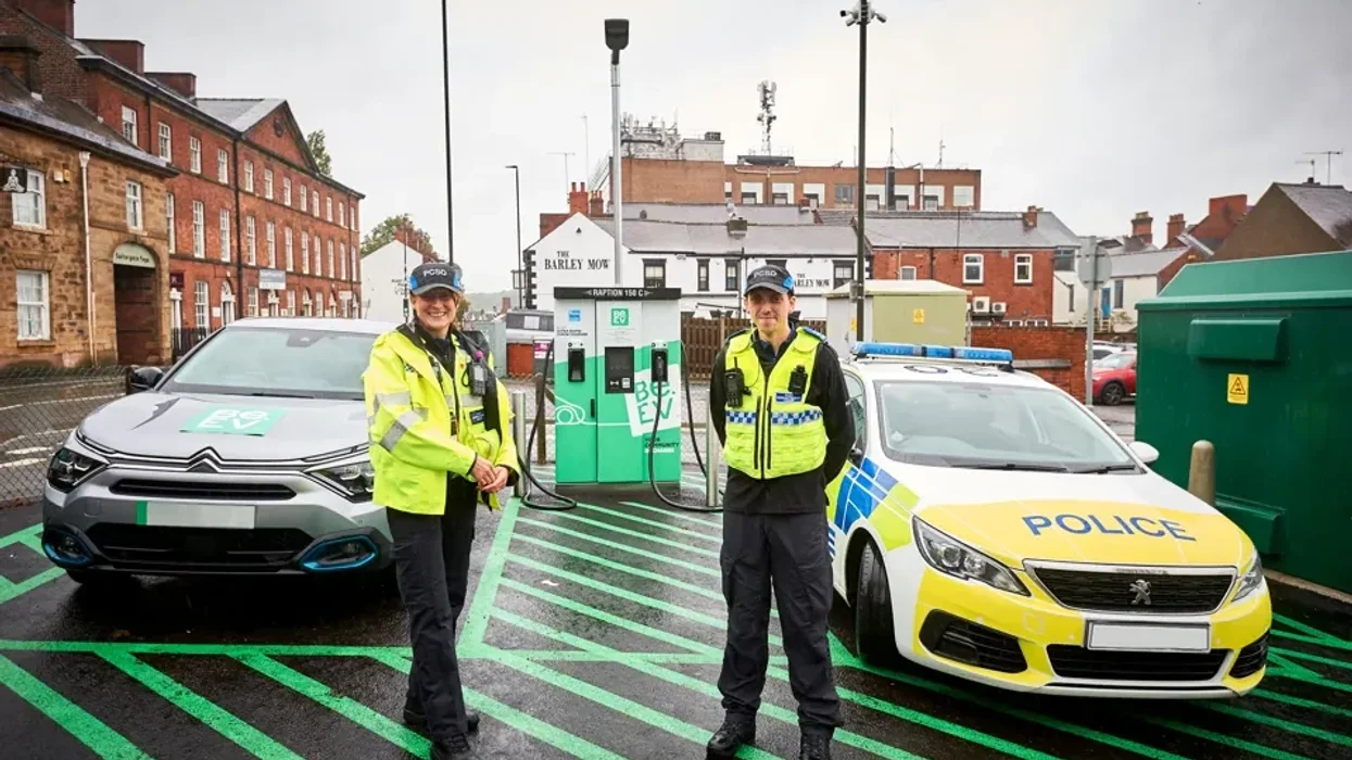 Derbyshire Police in front of an electric vehicle charging station in Chesterfield