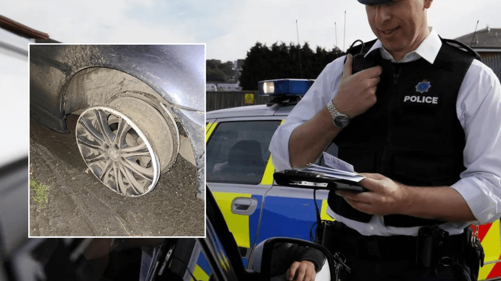Detatched tyres and police car
