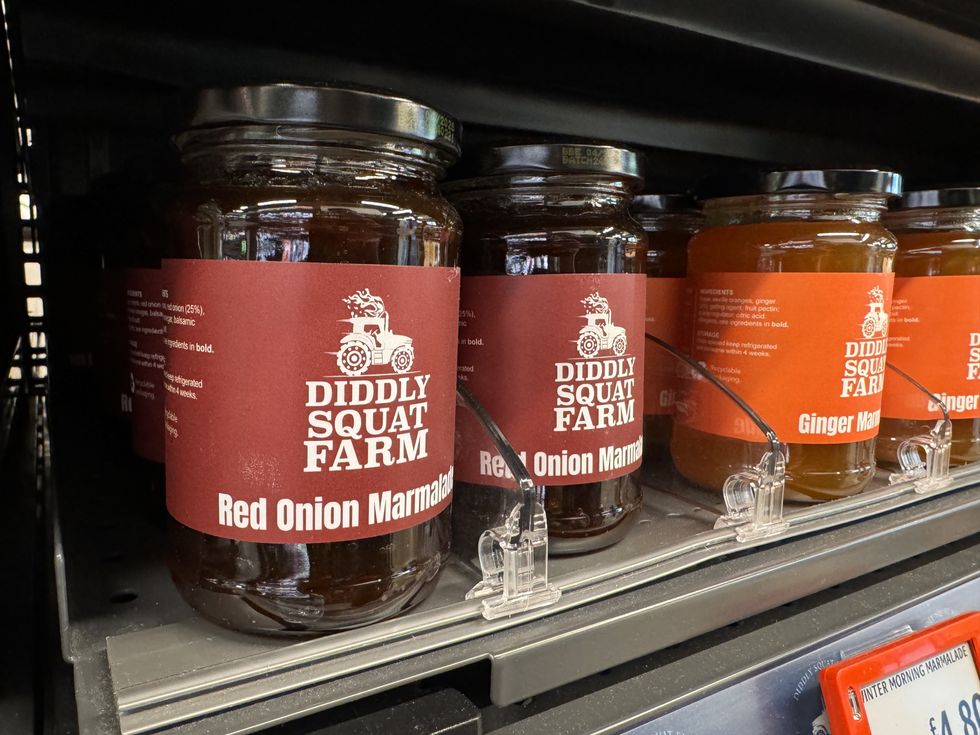 diddly squat farm shop jars shown on store shelves in an amazon fresh shop