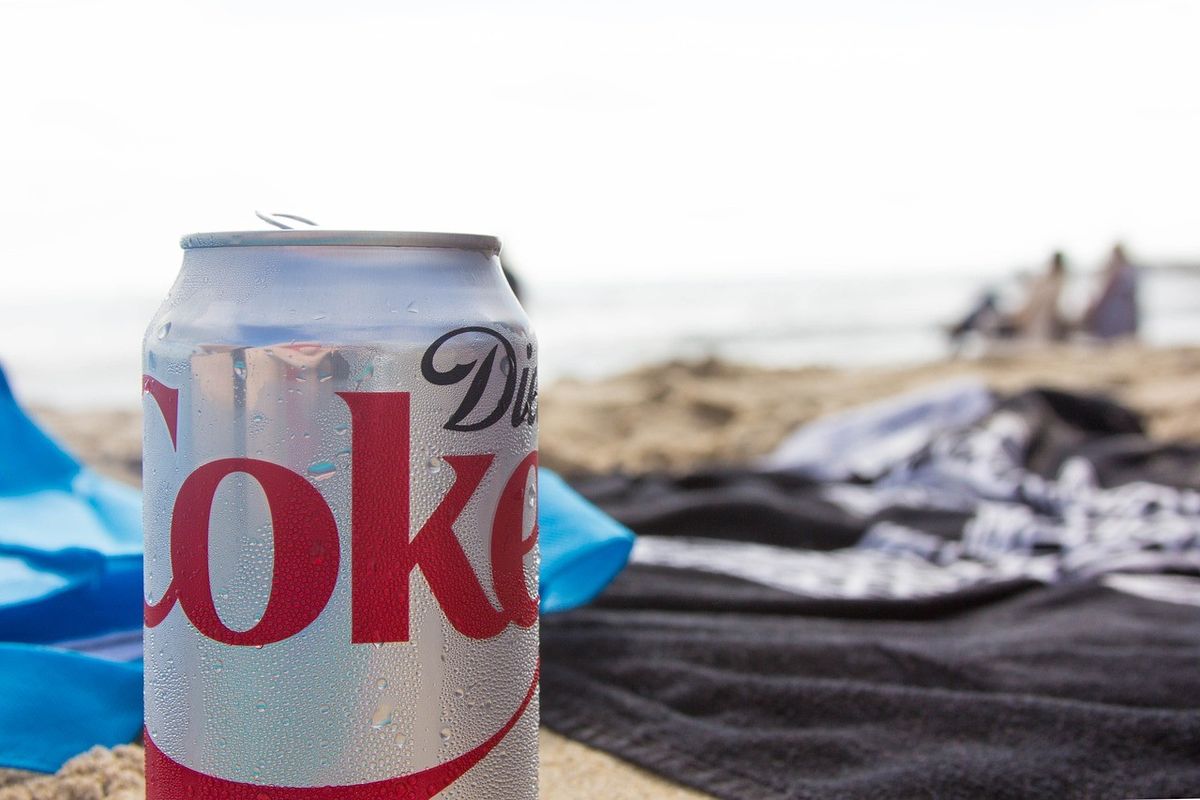 Diet Coke can on a beach