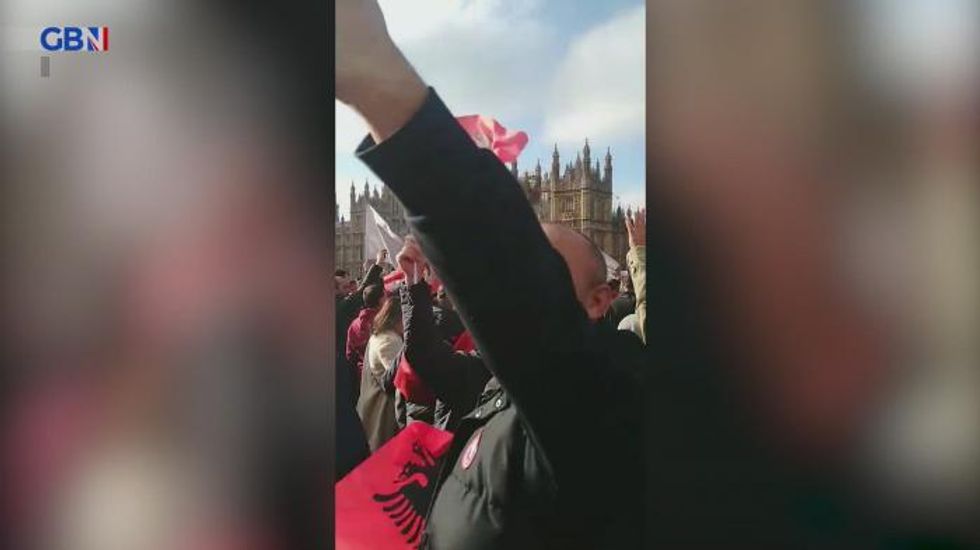‘Disgrace’ - Albanians drape national flag over CHURCHILL amid huge London protests