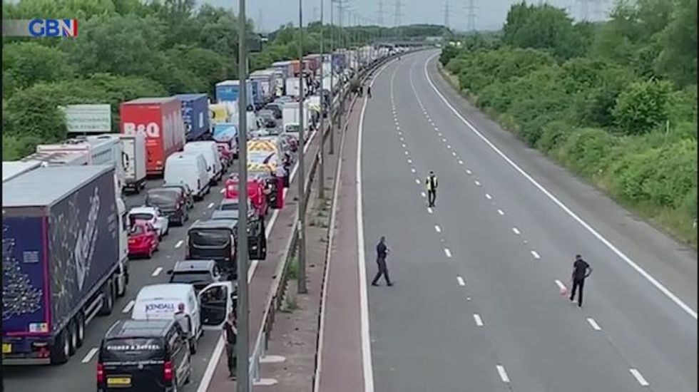 M4 motorists play football on motorway as protests bring traffic to halt