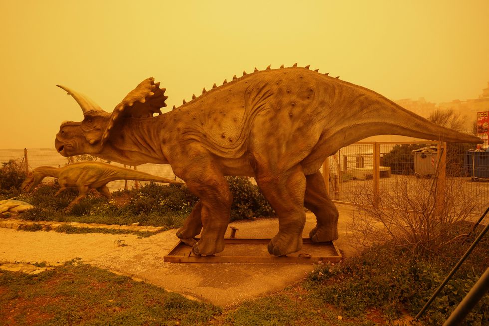 Dinosaur sculptures in Crete with dust