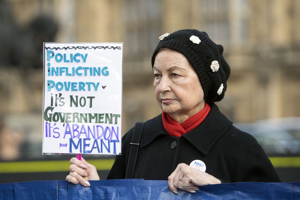 Disabled People Against Cuts protest outside Parliament against government cuts to Personal Independent Payments