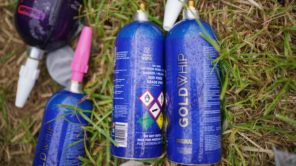 Discarded nitrous oxide canisters in a car park, at the Glastonbury Festival at Worthy Farm in Somerset