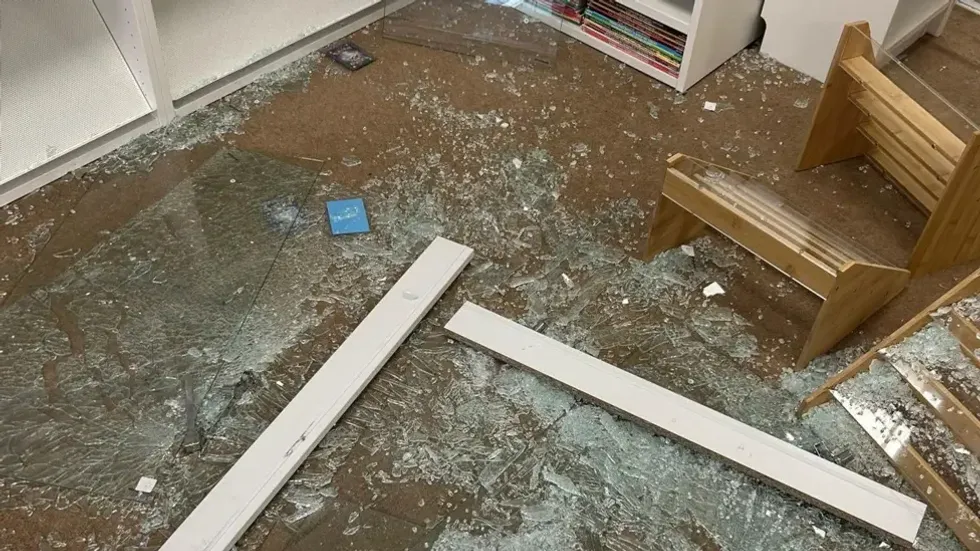 Display cabinets were left smashed with glass covering the floor
