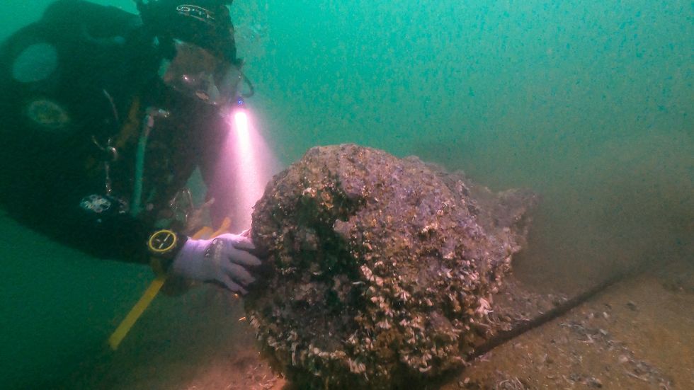 Diver inspects the treasures of the Northumberland shipwreck