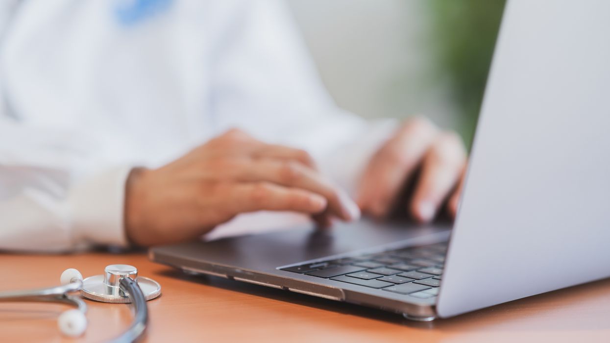 Doctor at laptop (stock)