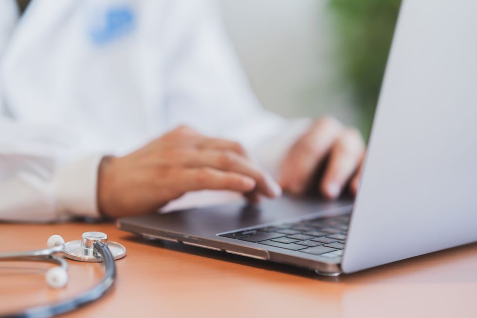 Doctor at laptop (stock)