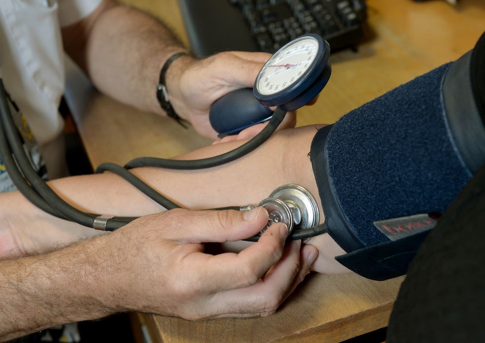 Doctor checking a patient's heart rate
