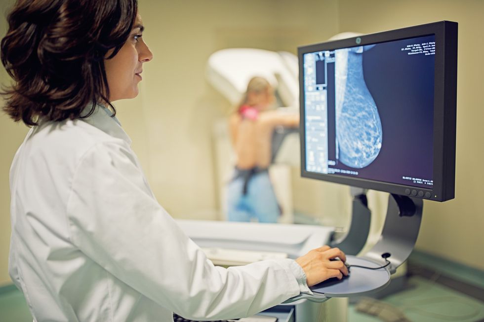 doctor checking breast cancer scan
