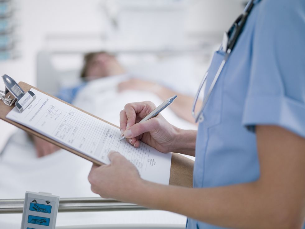 Doctor looking through a patient chart