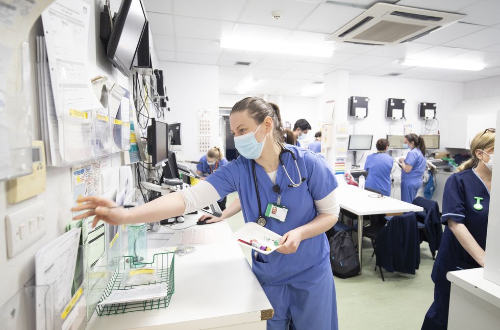 Doctors and nurses working in the clinical hub of the Emergency Department at the Royal Alexandra Hospital in Paisley. Picture date: Wednesday January 27, 2021.