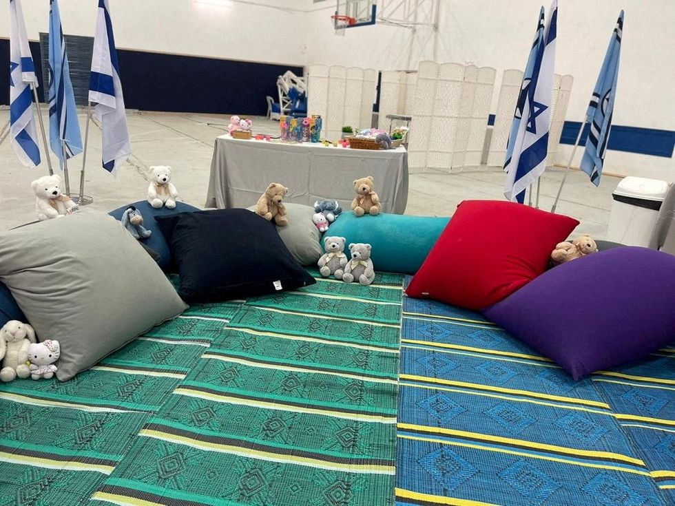 Dolls, colourful throw-rugs and personal hygiene have been set up for incoming hostages\u200b