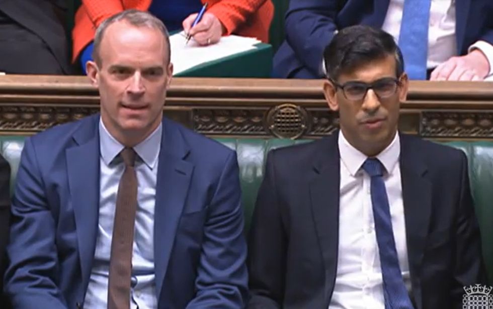 Dominic Raab sat with Rishi Sunak in the House of Commons
