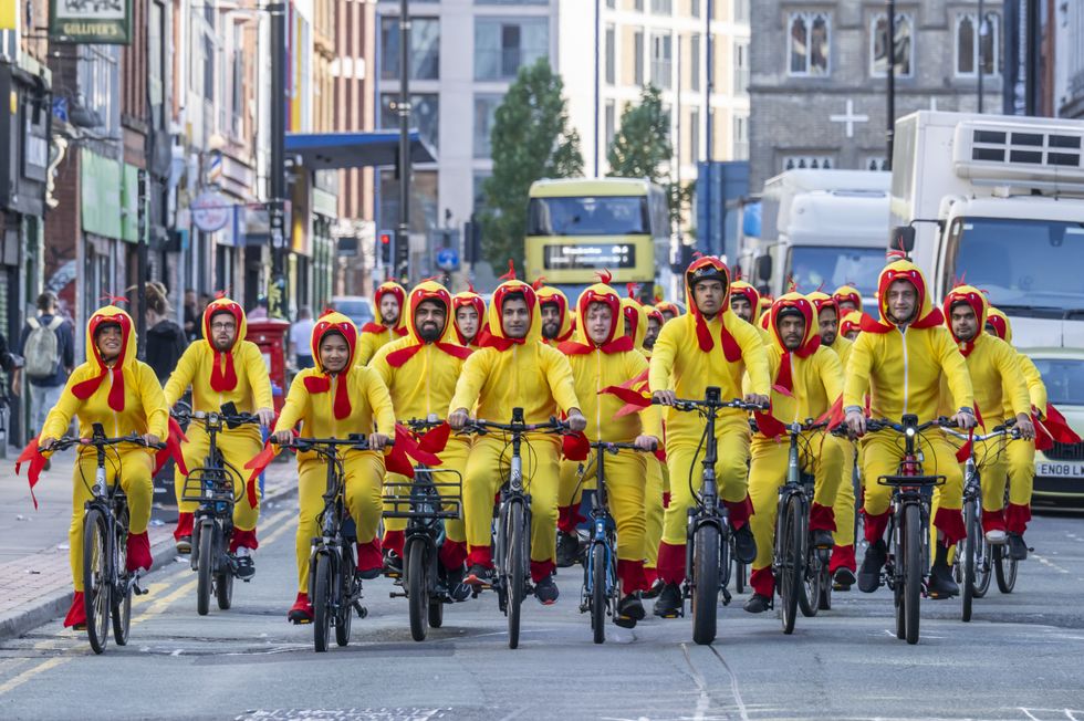 Domino's delivery staff dressed up as chickens for CHICK 'N' DIP launch