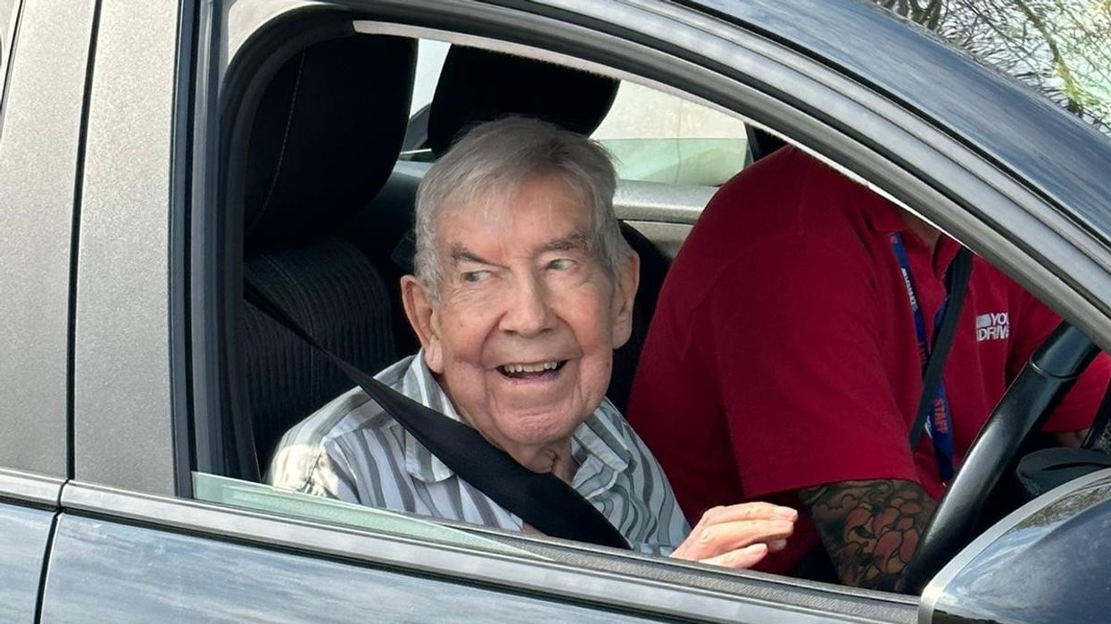 Don Mitchell driving a Vauxhall