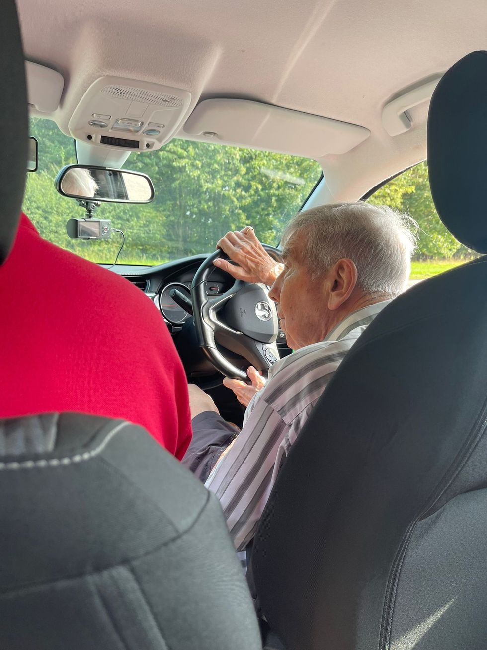 Don Mitchell driving a Vauxhall