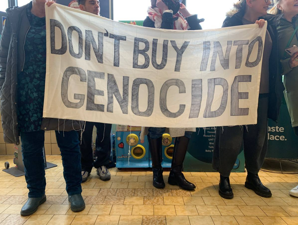 'Don't buy into genocide' sign