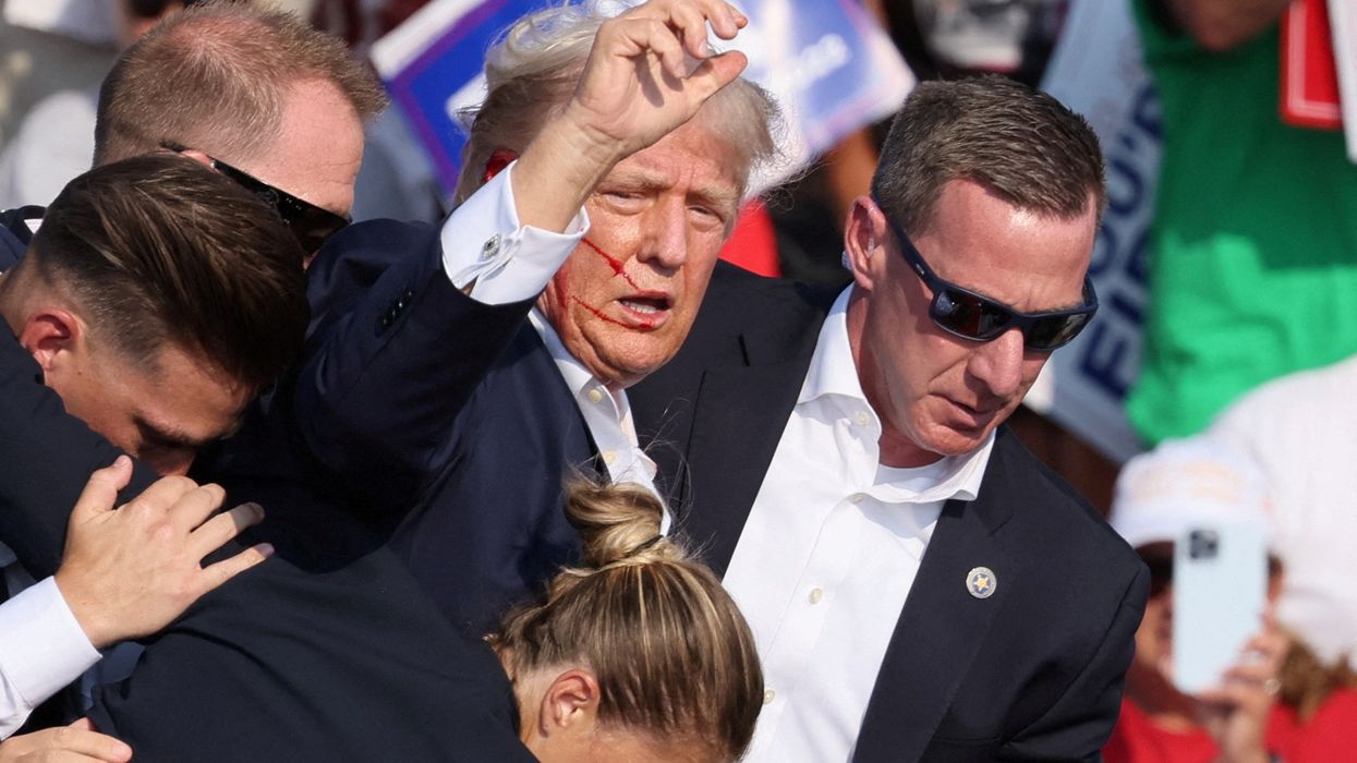 Donald Trump after being shot in the ear