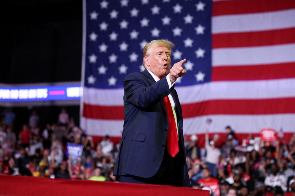 Donald Trump gestures during a campaign event in Philadelphia