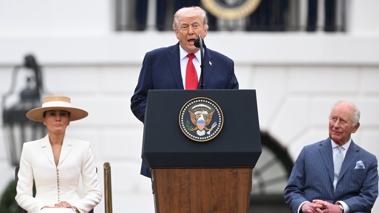 Donald Trump giving a speech on the White House lawn in front of King Charles and Queen Camilla