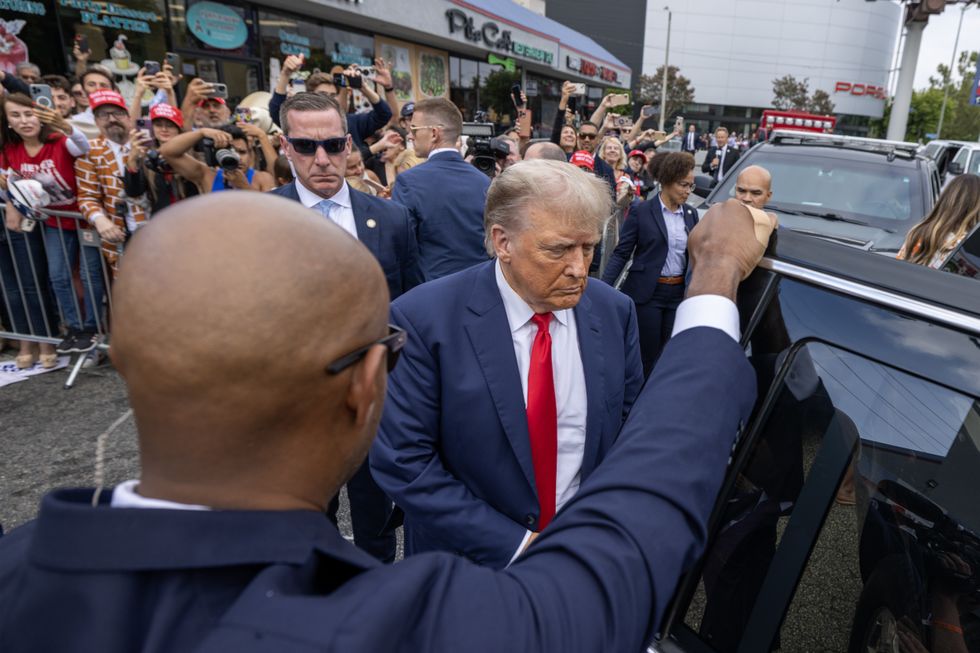 Donald Trump leaves after greeting fans outside a Carvel Ice Cream and Cake Shop during the California GOP convention