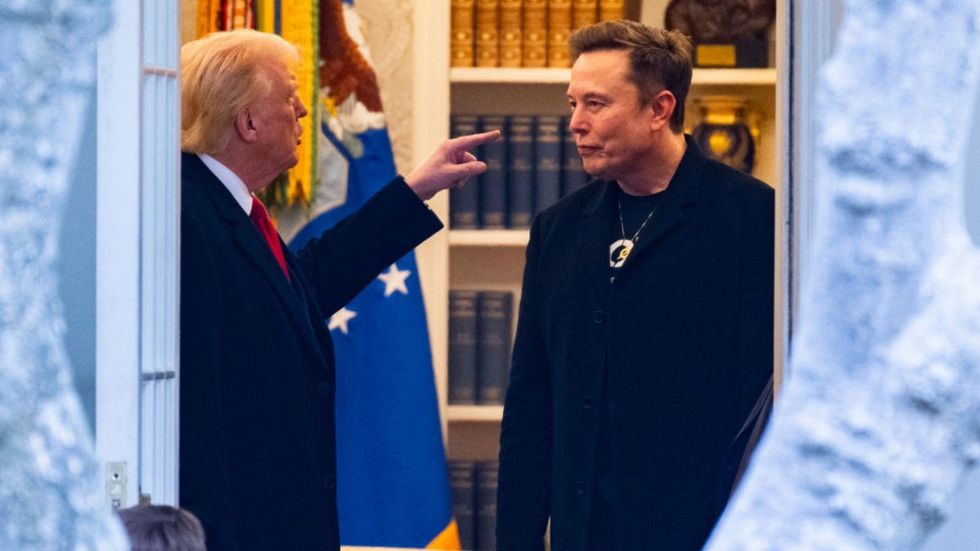 Donald Trump points at Elon Musk