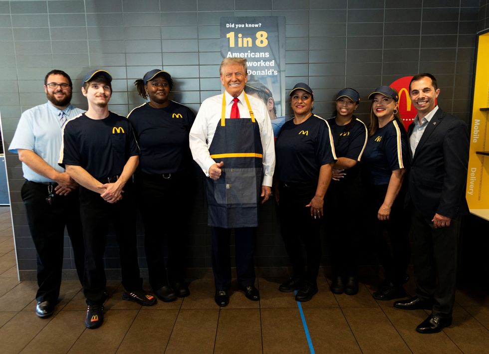 Donald Trump poses with staff from the McDonald's store\u200b
