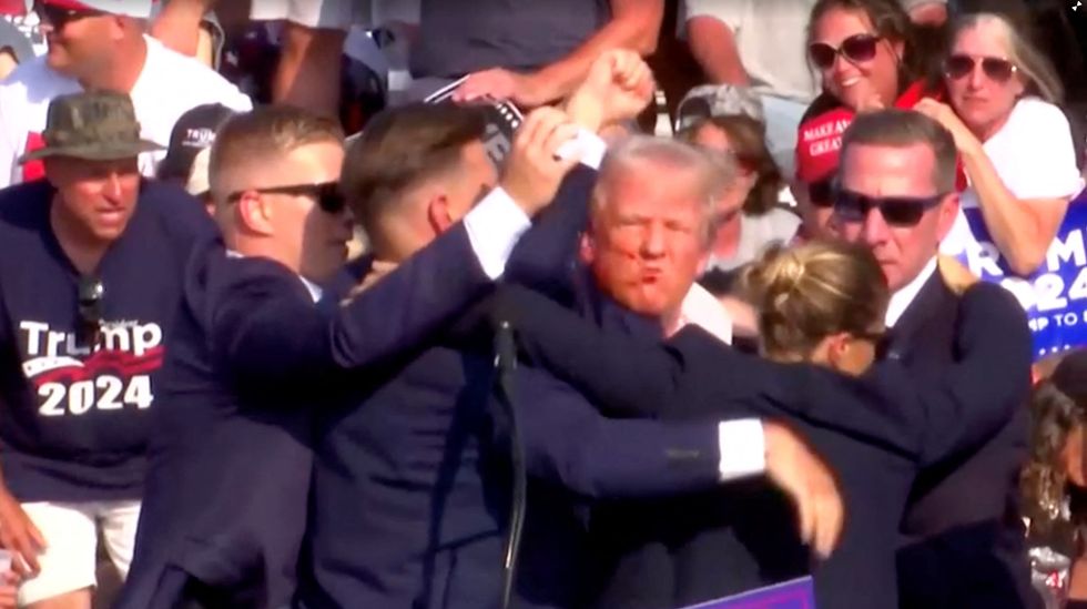 Donald Trump raises his fist