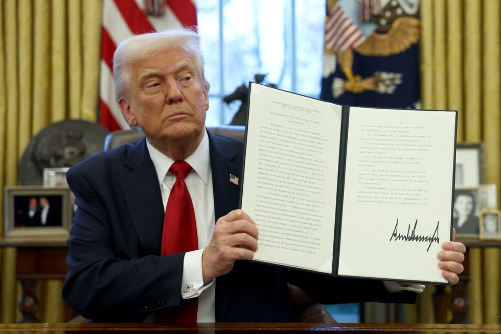 Donald Trump signing the 25 per cent tariff on foreign car imports \u200b