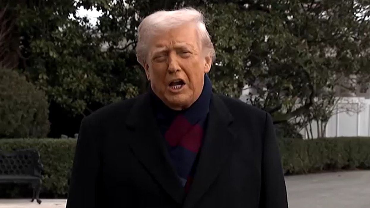 Donald Trump speaks to reporters outside White House