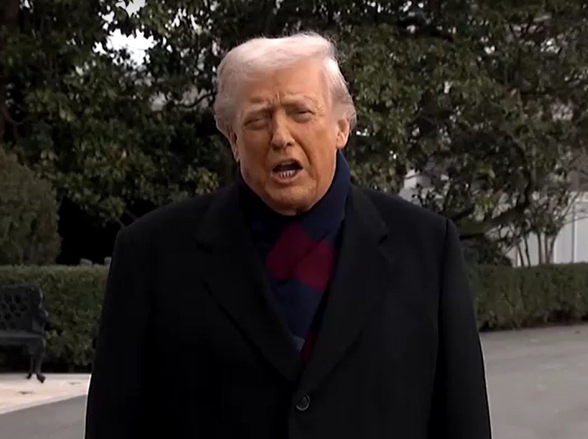 Donald Trump speaks to reporters outside White House