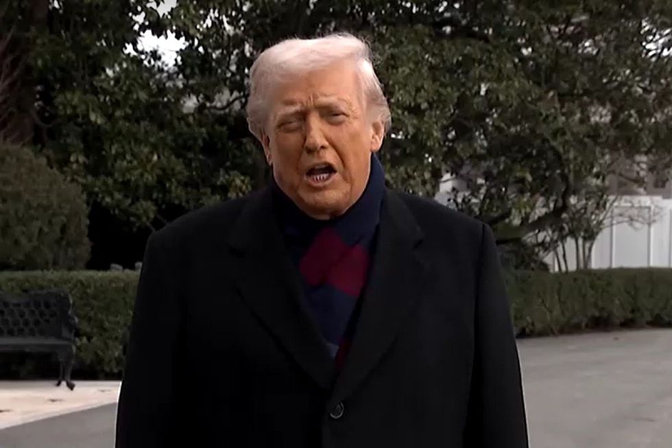 Donald Trump speaks to reporters outside White House